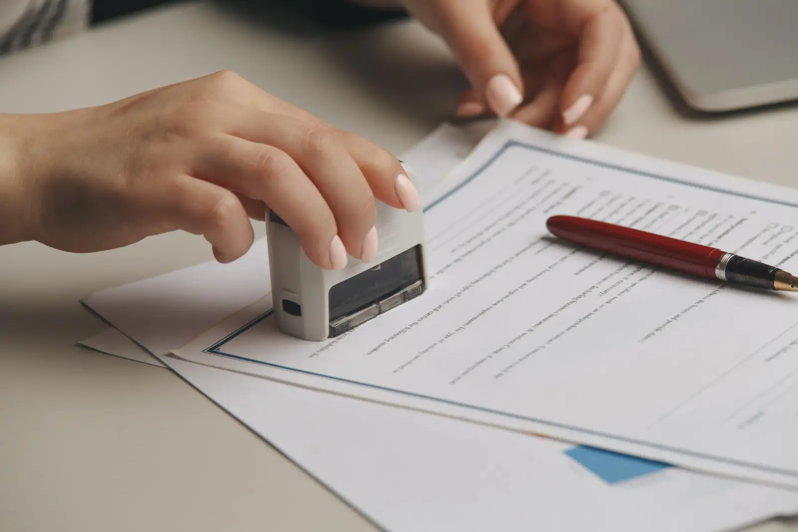 Notary stamping a signed document